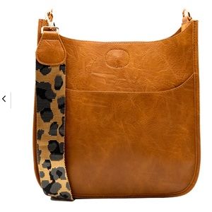 Ahdorned messenger bag is guaranteed to be your new go-to., NWOT